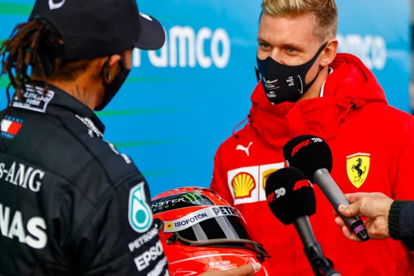 FOR SOCIAL20 Hamilton presented with schumacher helmet